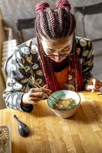 Midsection of woman holding food