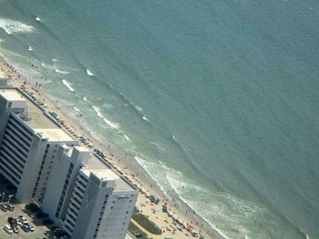 High angle view of cityscape by sea