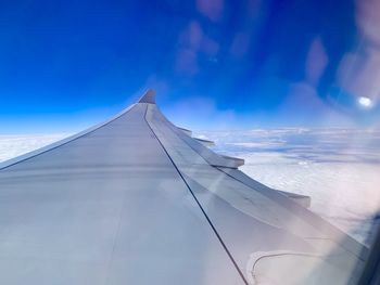 Low angle view of airplane against sky