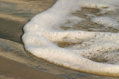 Close-up of surf on beach