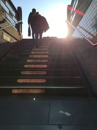 Low angle view of woman walking on steps