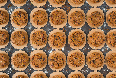 Full frame shot of chocolate chip cookies on black background