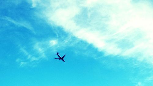 Low angle view of airplane flying in sky