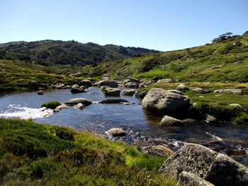 Scenic view of rocks in mountains against sky