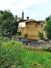 Old building on field against sky