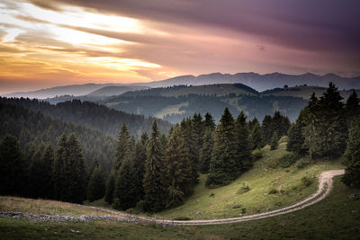 Scenic view of landscape against sky during sunset