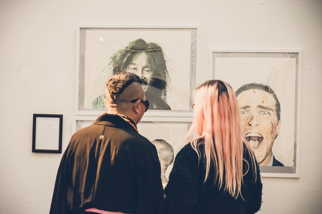 YOUNG COUPLE KISSING IN CORRIDOR