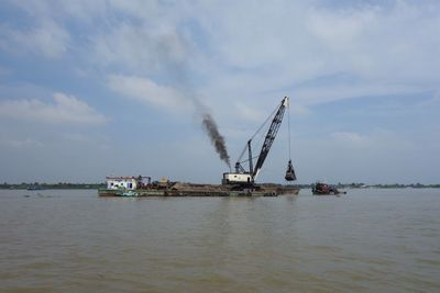 Ship in sea against sky