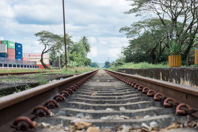 Surface level of railroad tracks against sky