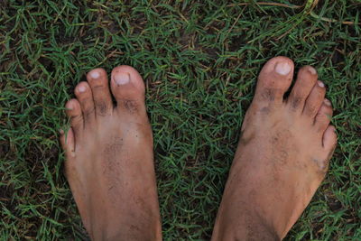Low section of man legs on field