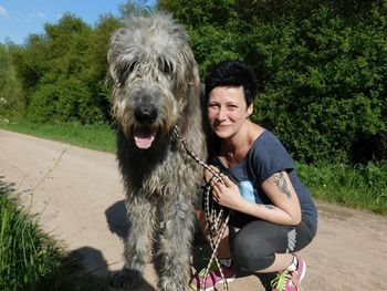 Portrait of smiling woman with dog