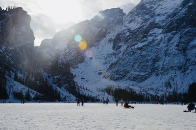 Scenic view of snow covered mountains against sky