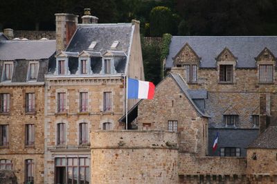 Houses against buildings in city in france