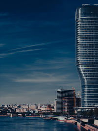 Modern buildings in city against sky