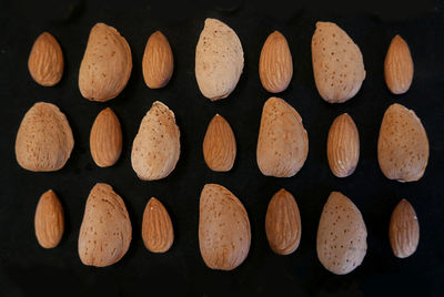 Full frame shot of almonds on black background