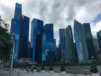 Skyscrapers in city against sky