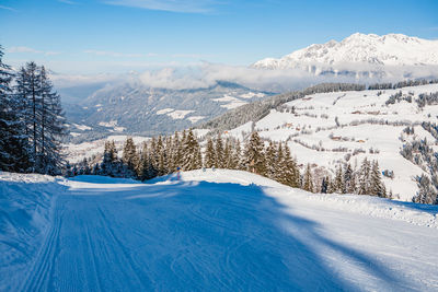 High angle view of snow covered land against sky