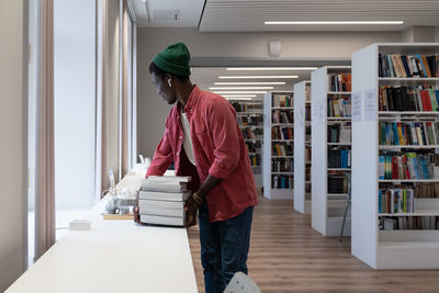 Side view of man working at home