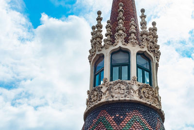 Low angle view of ornate building against sky