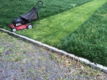 Lawn mower on grassy field