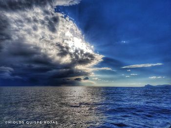 Scenic view of sea against blue sky