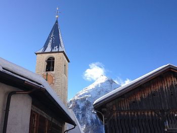 Low angle view of building against sky during winter