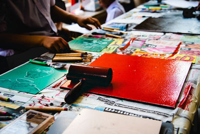 Close-up of people working on table