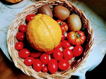 High angle view of tomatoes in basket on table