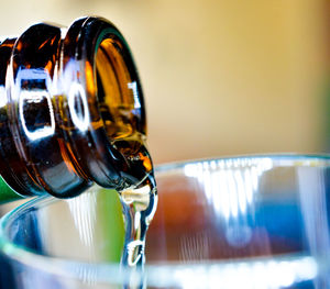 Close-up of beer glass bottle on table