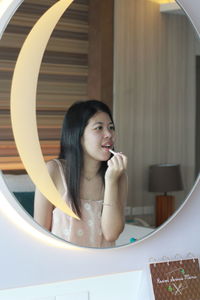 Portrait of young woman in bathroom