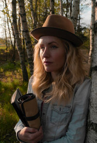 Portrait of beautiful young woman in hat