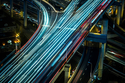 Light trails on road in city at night