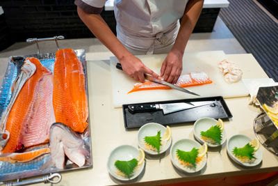 High angle view of fish on cutting board