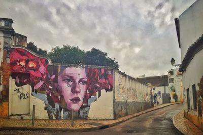 Graffiti on wall against sky