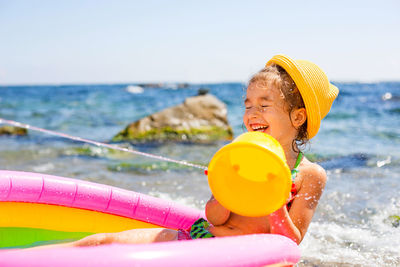 Happy girl against sea