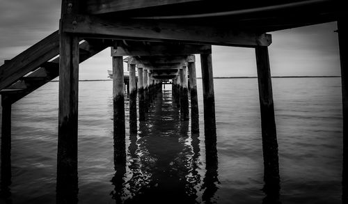 Bridge over sea against sky