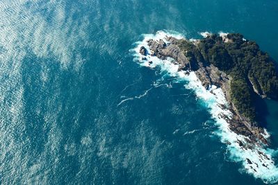 High angle view of rocks in sea