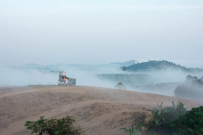 Scenic view of hills against sky