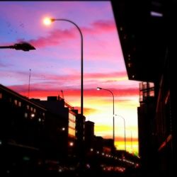 Low angle view of building against sky at dusk