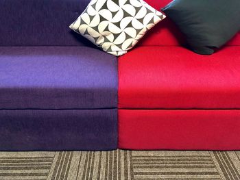 High angle view of people relaxing on sofa at home