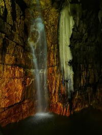 Scenic view of waterfall in forest