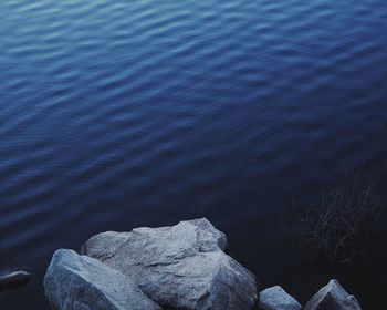 High angle view of rocks in lake