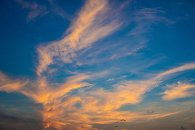 Low angle view of dramatic sky during sunset