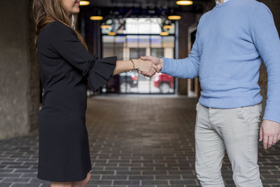 Man and woman shaking hands