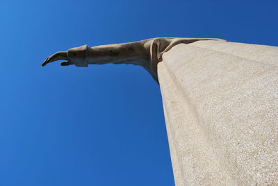 Low angle view of built structure against clear blue sky