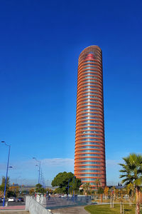View of modern building against blue sky