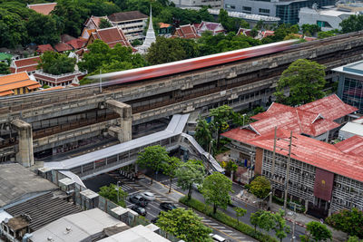 Bangkok, thailand - 10 august 2022 - time lapse view of bangkok bts skytrain and pedestrian skywalk