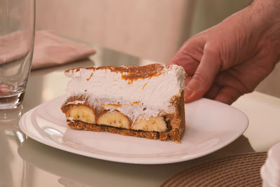 Cropped hand of person having breakfast