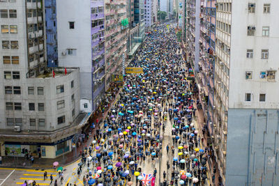 High angle view of crowd on street against buildings