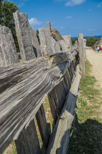 Close-up of wood against sky
